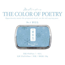 A vintage craft oil-based ink pad labeled Haze Blue, featuring a square glass container with snowflake designs.