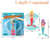 A diving game set featuring a mermaid figure inside an opening shell and a separate mermaid doll.