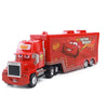 A red Lightning McQueen diecast toy hauler truck with a custom design and lights.