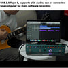 A portable guitar multi-effects processor is connected to a computer for software recording.