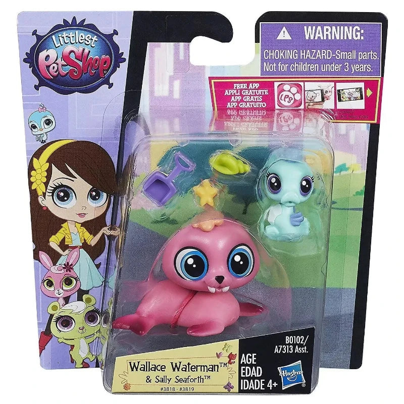 A set of three small plastic animal figures, including a pink hedgehog and a blue creature, packaged in a clear plastic displ