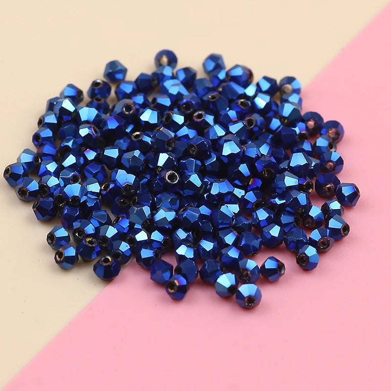 A pile of dark blue iridescent crystal glass beads for jewelry making