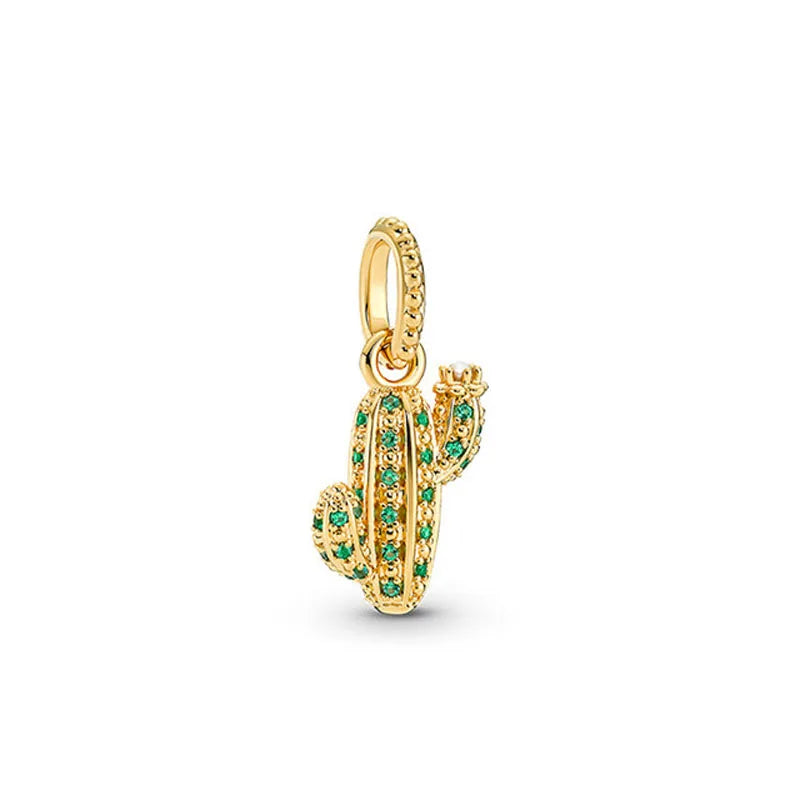 Gold charm bracelet featuring pendants shaped like an elephant, key, butterfly, and heart.
