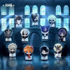 A collection of chibi figurines representing Fatui Harbingers in various outfits and colors displayed on a dark surface.