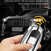 A hand holds a silver key case cover designed for Infiniti models, demonstrating a scientific hollow design.