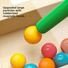 A close-up view of colorful magnetic beads and large particles used in a maze toy for counting and fine motor skills.