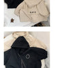 A beige kids hooded zip-up jacket with a letter print on the chest is displayed on a white surface.