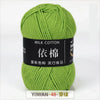 A ball of light green milk cotton yarn labeled YIMIAN 48 and featuring Chinese characters for knitting and crochet.