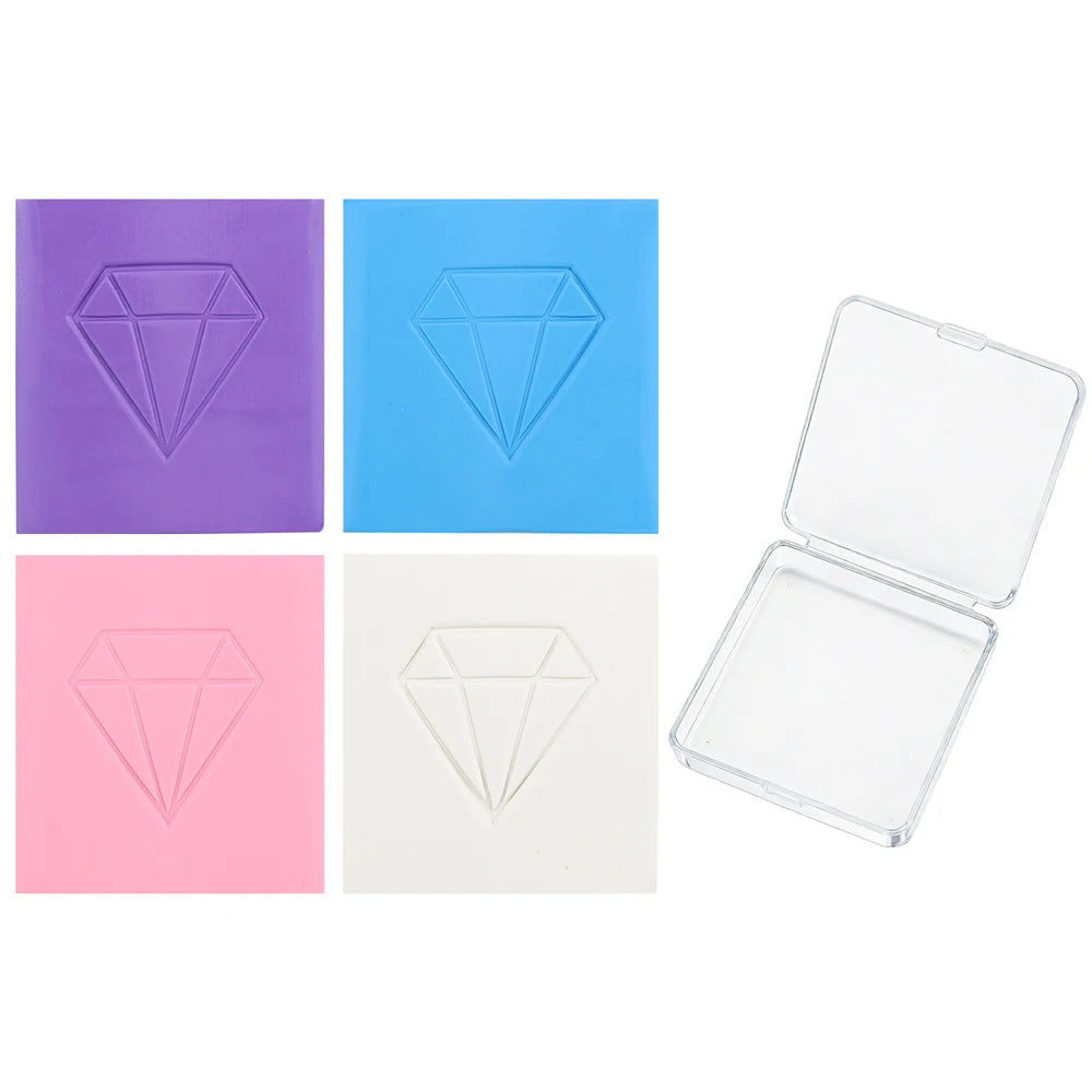 Four colored clay diamonds are shown, including purple, blue, pink, and white, with one open clear plastic box.
