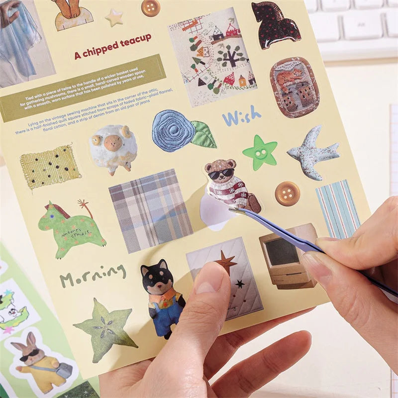 A page from a sticker book featuring various retro aesthetic stickers like a chipped teacup, wish, and morning themes.