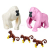 A set of six African wildlife animal building blocks, including a white elephant, a pink gorilla, and three brown monkeys.