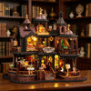 A detailed wooden miniature castle dollhouse kit featuring architecture, furniture, and illuminated elements.