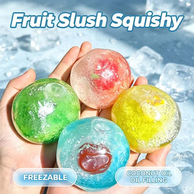 Hand holding colorful fruit slush squishy stress relief balls including green, pink, and yellow varieties