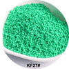 A pile of bright green 1.5mm solid glass seed beads in a white bowl.