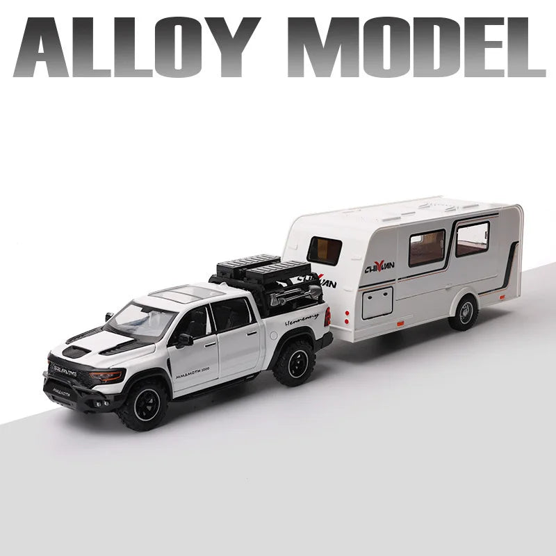 A white diecast model of an RV camper truck with a black roof and wheels.