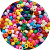 A close-up view of a large pile of multicolor pony beads in various shapes and colors for jewelry making.