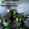 A detailed 1:10 scale die-cast model of a black and lime green motorcycle with chrome accents.