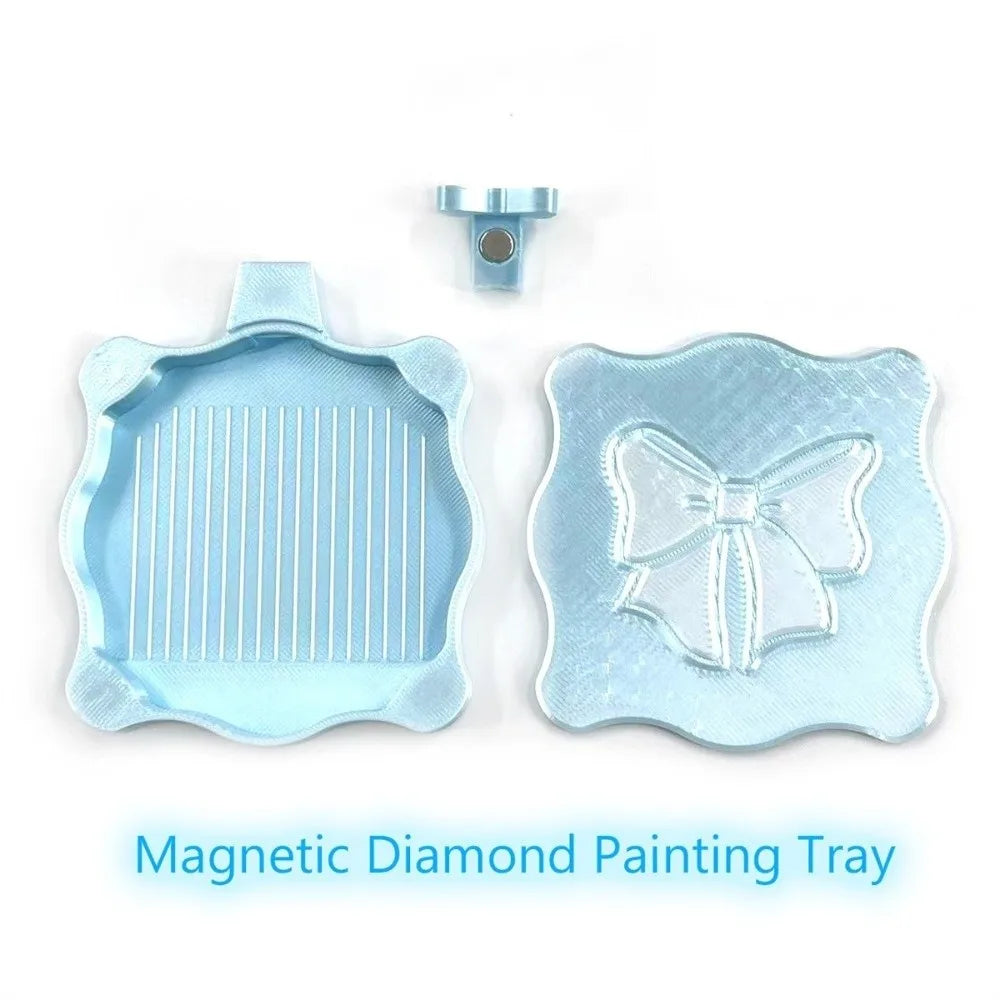 A light blue magnetic diamond painting tray with a lid and a decorative bow design.