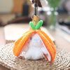 An orange fruit bunny plush toy with white fur and green ears hanging from a hook.