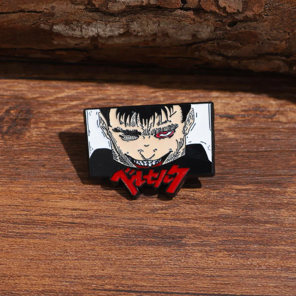 Black and white enamel lapel pin featuring a fierce, snarling face with red eyes and Japanese text.