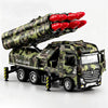 A diecast military missile truck toy with red missiles is shown in a camouflage pattern.
