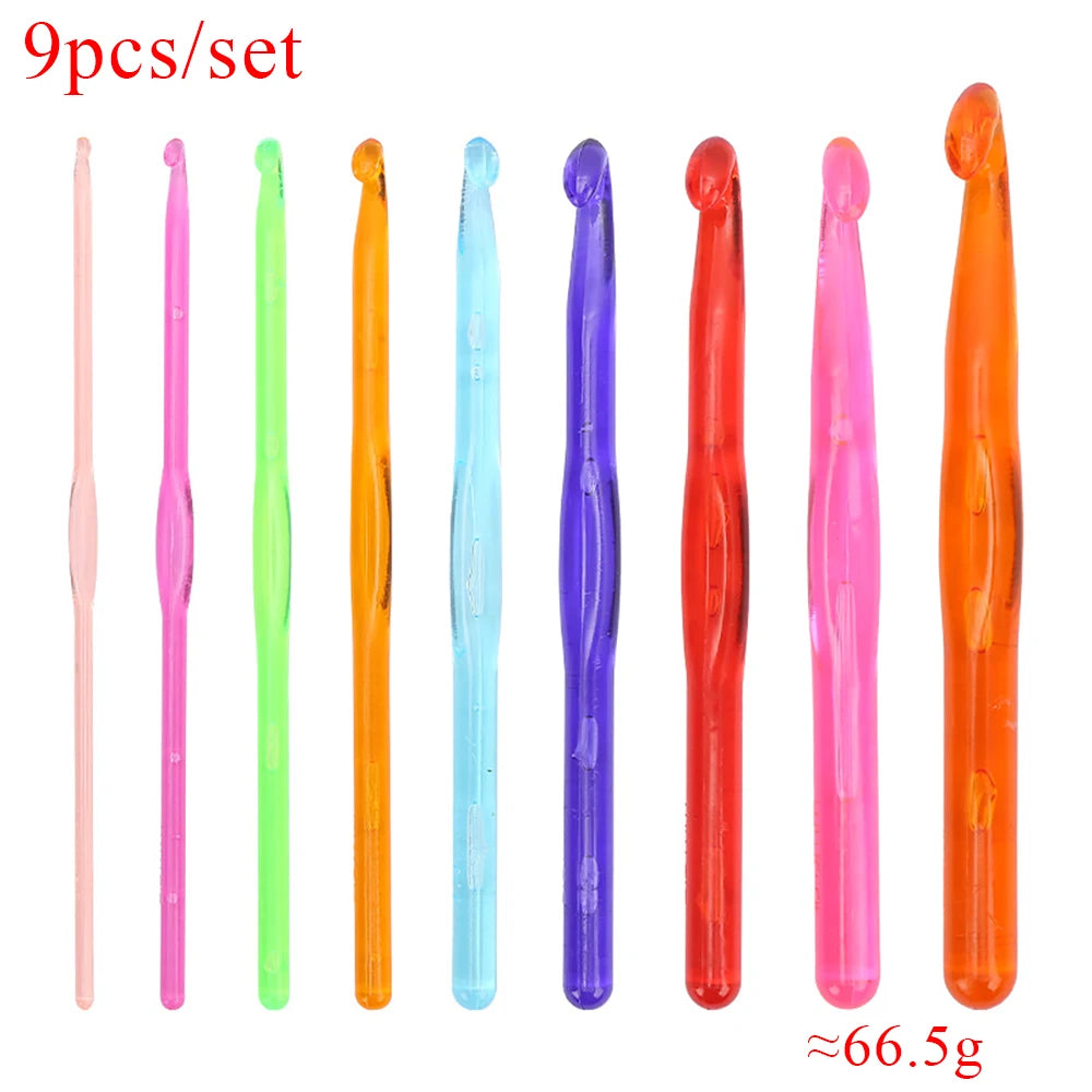 A set of nine transparent crystal crochet hooks in various colors including pink, green, orange, and purple.