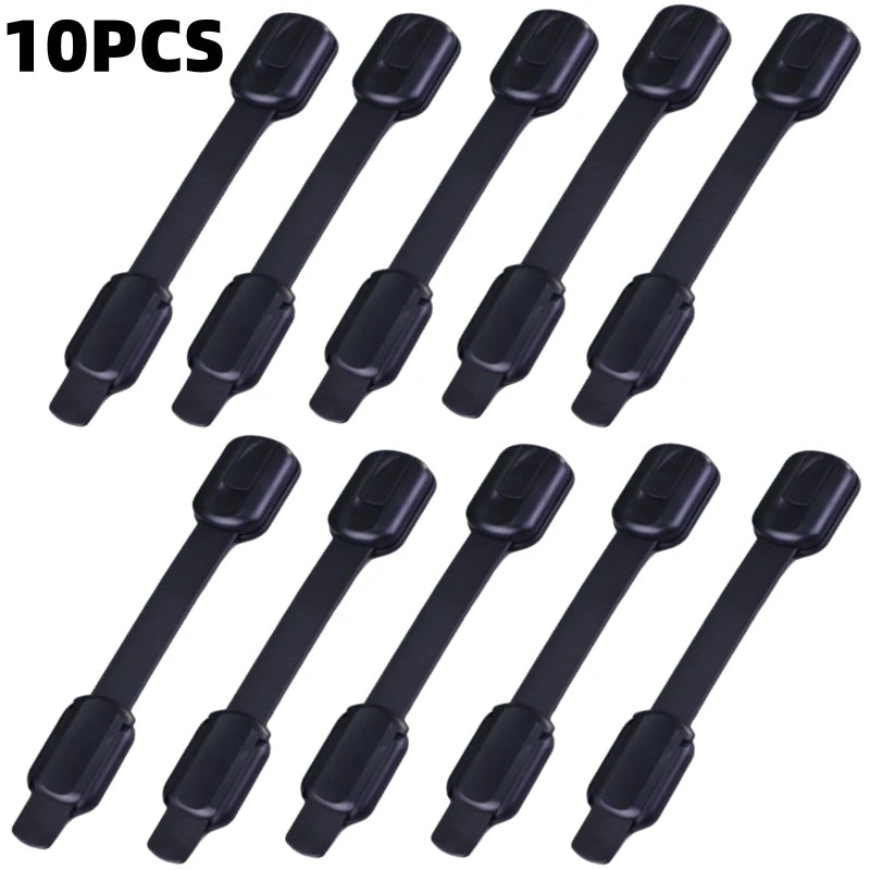 Ten black adhesive baby safety locks for cabinets and drawers.
