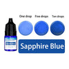 A bottle of Sapphire Blue liquid candle wax pigment with five separate dropper bottles showing one, five, and ten drops.