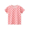 A pink short-sleeve cotton t-shirt for girls with a repeating pattern of smiling faces.