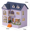 A purple wooden dollhouse kit shaped like a princess villa with detailed windows and roof shingles.