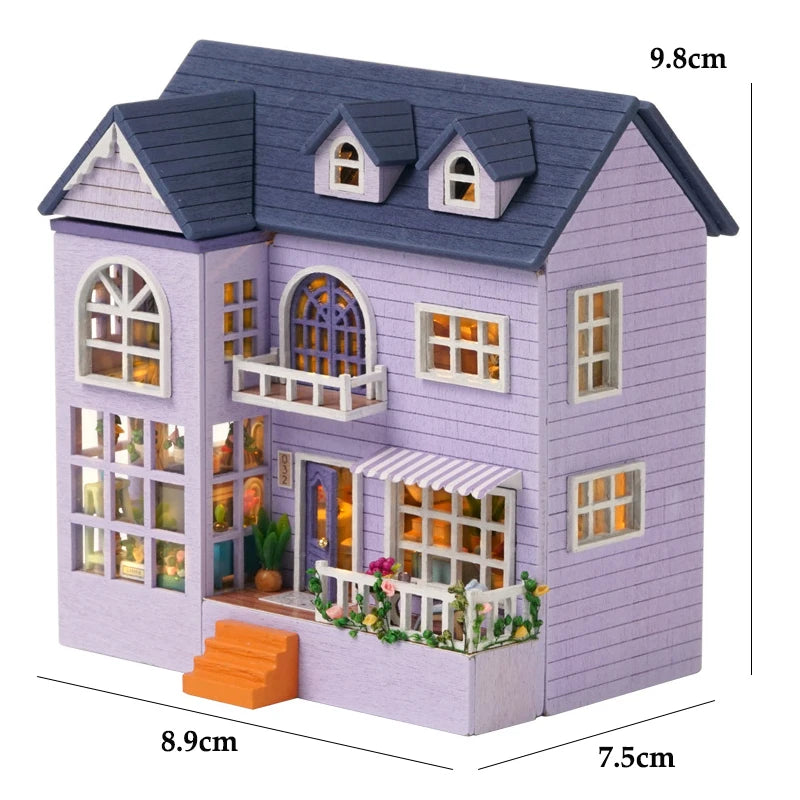 A purple wooden dollhouse kit shaped like a princess villa with detailed windows and roof shingles.