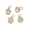 Three gold-toned rhinestone heart charms for jewelry making displayed against a white background.
