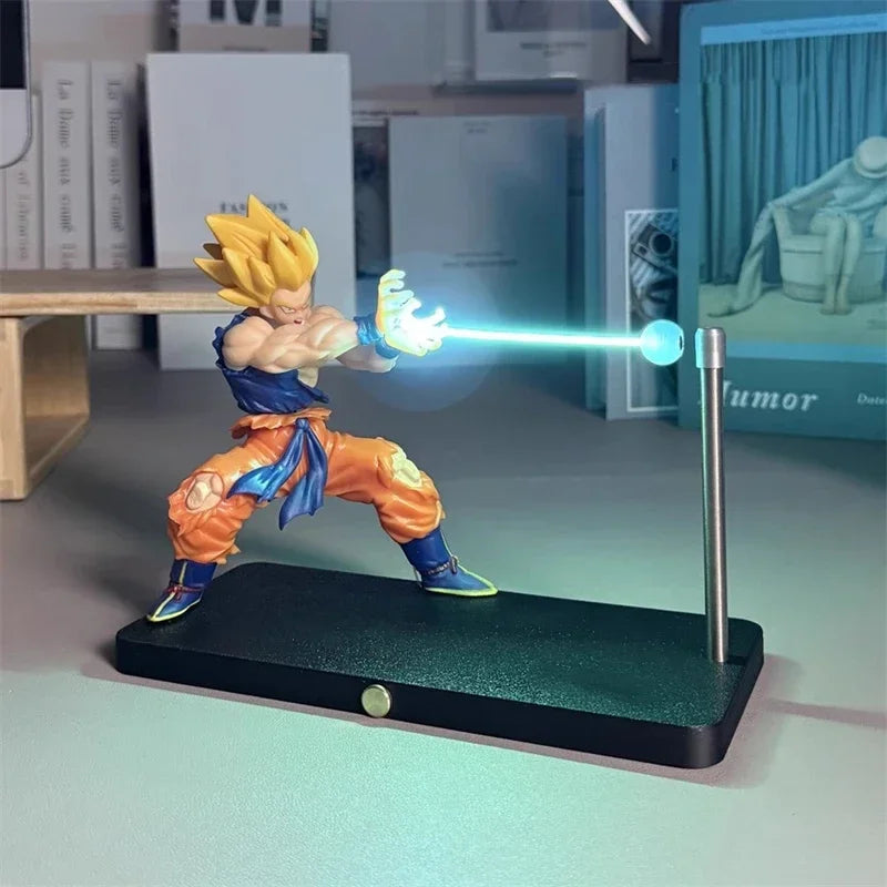 A figurine of Son Goku performing a Kamehameha pose, illuminated by a bright blue LED light.