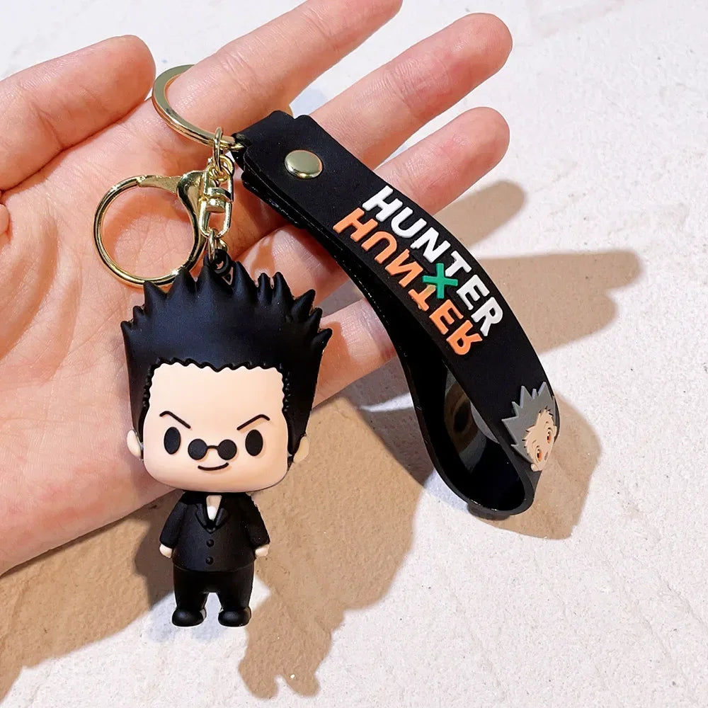 A black and white resin keychain of a Hunter x Hunter anime character with spiky hair and a dark outfit.
