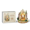A wooden floral book nook kit featuring an ornate, illuminated scene with plants and light.