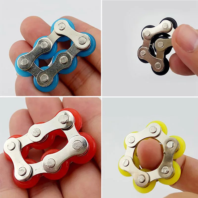 A hand holds a fidget toy featuring silver and colored plastic rollers used for a bike roller chain.