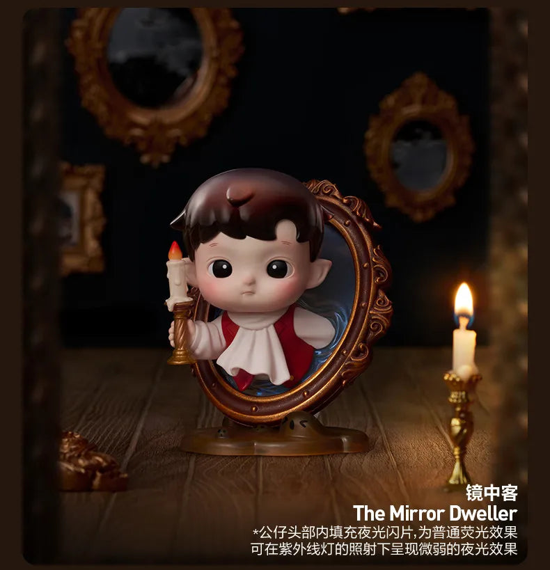 A collectible figure of a child with dark hair and rosy cheeks is displayed in an ornate mirror frame.
