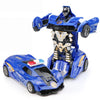 A blue transforming car robot toy with a black and gold armored figure.