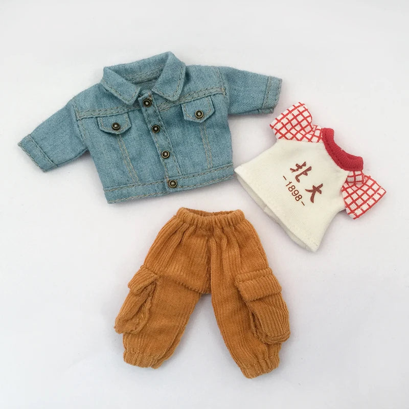 A denim jacket, tan pants, and a small patch with Japanese characters are displayed together.