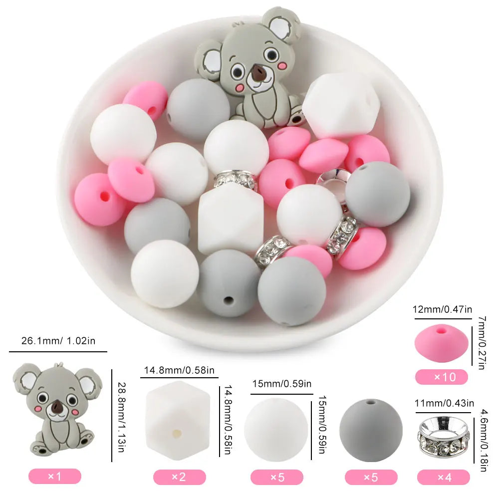 A white bowl filled with various gray and pink silicone beads shaped like cartoon animals for DIY jewelry making