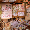 A collection of vintage stickers and paper samples for crafting, including floral designs and aged textures.