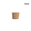 A small, cylindrical piece of natural wood used as a tapered bottle or test tube stopper.