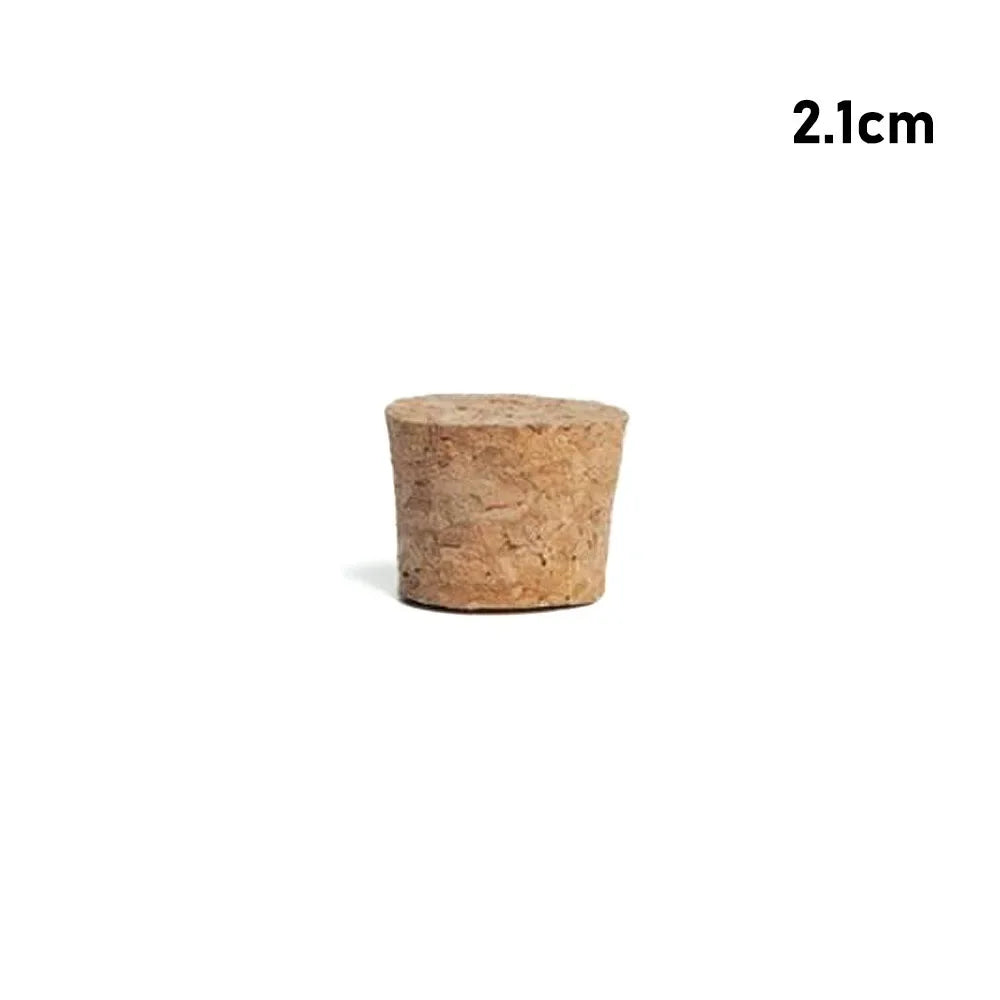 A small, cylindrical piece of natural wood used as a tapered bottle or test tube stopper.