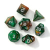 A set of seven polyhedral acrylic dice showing various numbers and colors on a white surface.