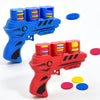 A red soft foam flying disc launcher toy with blue and yellow colored discs scattered nearby.