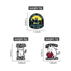 A set of four black cat enamel pins with various text designs and sizes.