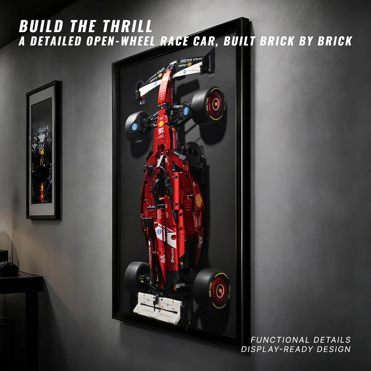 A detailed brick build of a red open-wheel racing car displayed in a black frame.