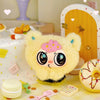 A fluffy yellow bear blind box pendant with large eyes and pink accents displayed on a light surface.