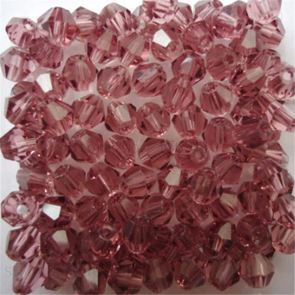 A pile of pink rose quartz crystal beads for DIY jewelry making