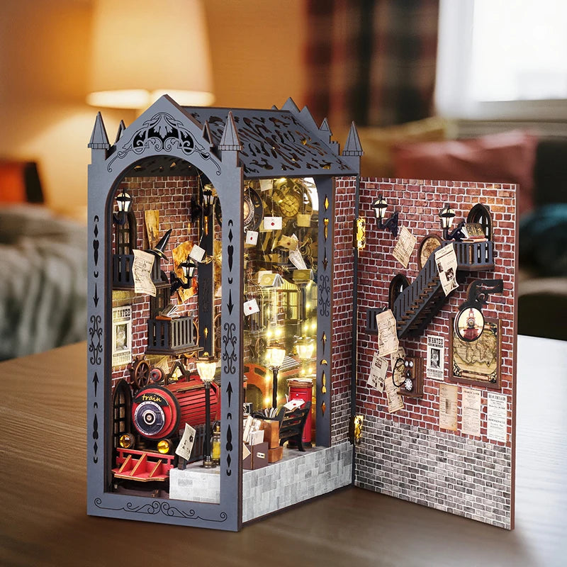 A DIY wooden book nook kit featuring a brick facade and detailed miniature scene with integrated LED lights.
